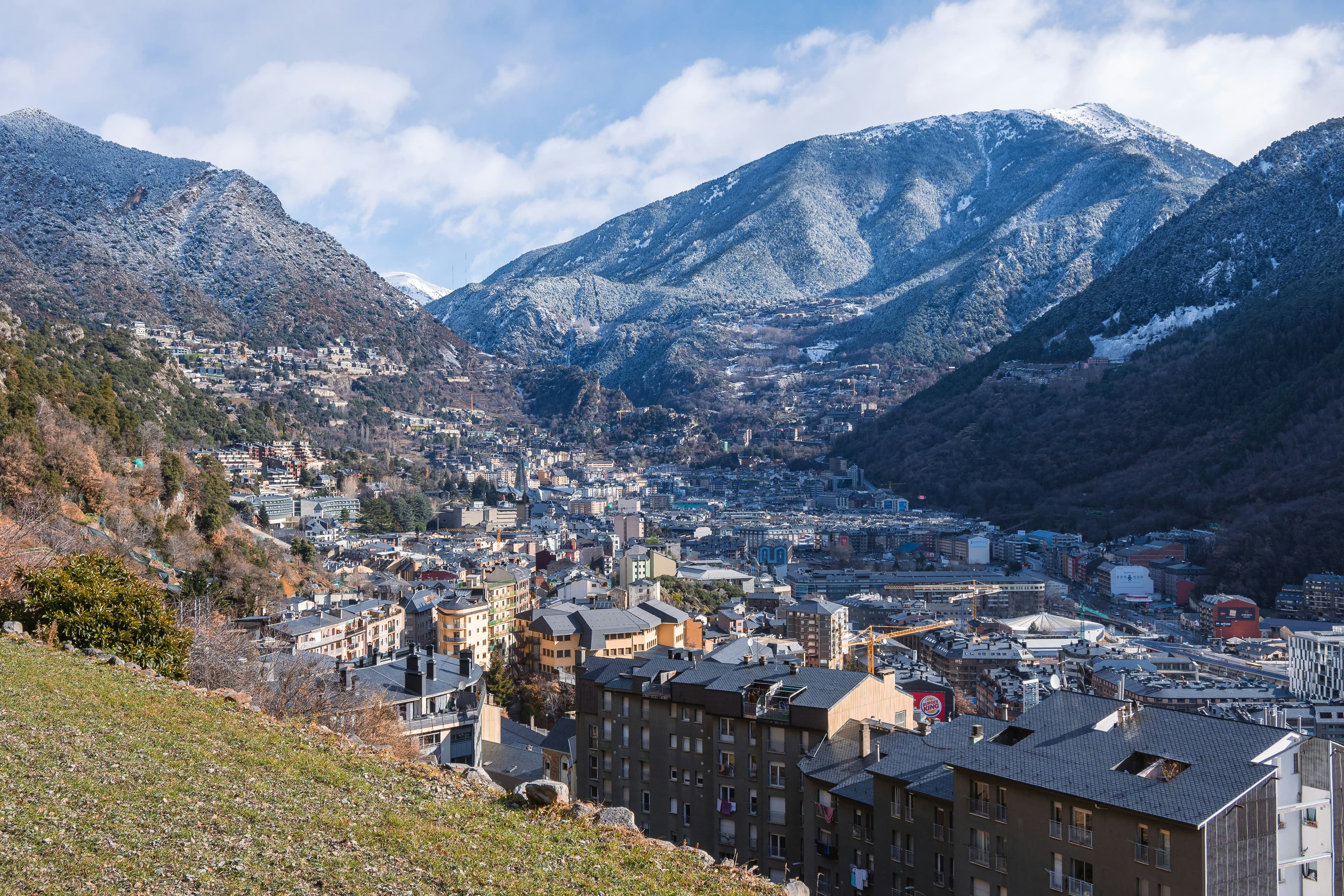 Andorra la Vella nestled in its valley, ringed by snowy Pyrenean mountains